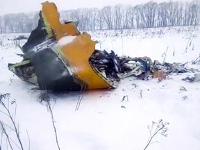 In this screen grab provided by the Life.ru, the wreckage of a AN-148 plane is seen in Stepanovskoye village, about 40 kilometres from the Domodedovo airport, Russia, Sunday, Feb. 11, 2018. Russia's Emergencies Ministry says a passenger plane has crashed near Moscow and fragments of it have been found.