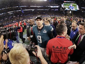 Philadelphia Eagles quarterback Nick Foles (9) walks on the field after winning the NFL Super Bowl 52 football game against the New England Patriots, Sunday, Feb. 4, 2018, in Minneapolis. The Eagles won 41-33.