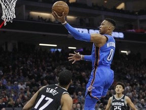 Oklahoma City Thunder guard Russell Westbrook (0) drives to the basket against Sacramento Kings guard Garrett Temple (17) during the first half of an NBA basketball game in Sacramento, Calif., Thursday, Feb. 22, 2018.