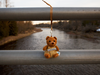 A teddy bear with the name of three-year-old Kaden Young now hangs from a bridge not far from where he was swept away by the flood water of the Grand River, in Waldemar, Ontario.