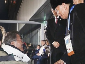 In this Sunday, Feb. 25, 2018, photo provided by South Korea Presidential Blue House via Yonhap News Agency, South Korean President Moon Jae-in, left, shakes hands with Kim Yong Chol, vice chairman of North Korea's ruling Workers' Party Central Committee, during the closing ceremony of the 2018 Winter Olympics in Pyeongchang, South Korea. (South Korea Presidential Blue House/Yonhap via AP)