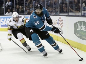 San Jose Sharks' Brent Burns, right, skates past Vegas Golden Knights' Nate Schmidt during the second period of an NHL hockey game Thursday, Feb. 8, 2018, in San Jose, Calif.
