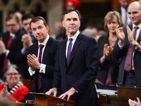 Finance Minister Bill Morneau receives an ovation after delivering the federal budget in the House of Commons in Ottawa on Tuesday, Feb.27, 2018.