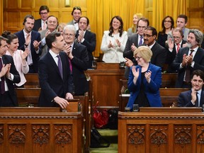 Finance Minister Bill Morneau receives an ovation while delivering the federal budget in the House of Commons in Ottawa on Tuesday, Feb.27, 2018.