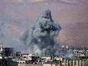 Smoke billows from an area that was targeted by Syrian government forces air strikes in the rebel-held town of Arbin, on the outskirts of the Syrian capital Damascus, on Feb. 1, 2018.