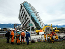 Rescue workers look at the Yun Tsui hotel which is leaning at a precarious angle, in the Hualien, Taiwan on Feb. 9, 2018, after the city was hit by a 6.4-magnitude quake earlier in the week.