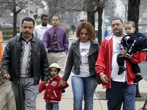 FILE - In this Thursday, April 2, 2009 file photo Miguel Roman, left, arrives at Superior Court in Hartford, Conn., with members of his family.