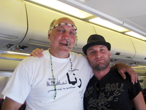 Former NHL player Dave “Tiger” Williams, left, during a 2010 military morale tour to Afghanistan with what appear to be beads stuck up his nose.