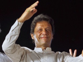 FILE - In this July 30, 2017, file photo, opposition leader Imran Khan of the Pakistan Taherik-e-Insaf party waves to supporters during a rally in Islamabad, Pakistan. Khan's party announced Monday, Feb. 19, 2018 that Pakistani cricket legend turned politician Khan has married a faith healer, ending rumors that he was considering a third marriage after divorcing two wives.