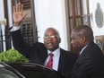 In this Feb. 6, 2018, file photo, South African President Jacob Zuma waves as he leaves parliament in Cape Town, South Africa, after it was announced that this year's state of the nation address that was to be delivered on Thursday will be postponed.