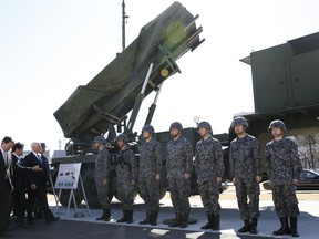 U.S. Vice President Mike Pence, third from left, inspects a PAC-3 interceptor missile system with Japanese Defense Minister Itsunori Onodera, second from left, at Defense Ministry in Tokyo Wednesday, Feb. 7, 2018. Pence, who arrived Tuesday in Japan, said he has not ruled out the possibility of meeting with North Korean officials at the upcoming Olympics in South Korea.