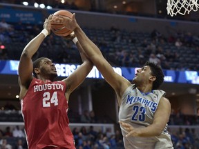 Houston forward Breaon Brady (24) shoots against Memphis forward Karim Sameh Azab (23) in the first half of an NCAA college basketball game Thursday, Feb. 22, 2018, in Memphis, Tenn.