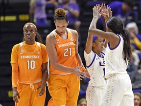 FILE - In this Jan. 28, 2018, file photo, Tennessee guard Meme Jackson (10) and center Mercedes Russell (21) walk by LSU's Jaelyn Richard-Harris (13) as she celebrates with guard Raigyne Louis (11) in the closing moments of LSU's 70-59 win in an NCAA college basketball game in Baton Rouge, La. After getting off to a 15-0 start, No. 15 Tennessee has split its last 12 games to fall to its lowest ranking of the season. A two-game skid has dropped the Lady Vols to a tie for sixth place in the Southeastern Conference. They're spending the final week of the regular season trying to sort out their problems and regain the momentum they had earlier this year.
