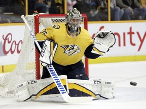 Nashville Predators goalie Pekka Rinne, of Finland, stops a shot against the St. Louis Blues in the first period of an NHL hockey game Sunday, Feb. 25, 2018, in Nashville, Tenn.