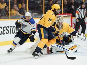 Nashville Predators defenseman P.K. Subban (76) skates the puck past Pekka Rinne (35), of Finland, as St. Louis Blues Jaden Schwartz (17) follows in the first period of an NHL hockey game Tuesday, Feb. 13, 2018, in Nashville, Tenn.