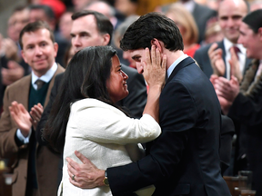 Prime Minister Justin Trudeau is embraced by the then minister of justice, Jody Wilson-Raybould, speaking on Indigenous rights in the House of Commons on Feb. 14, 2018.