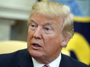 President Donald Trump in the Oval Office of the White House, Friday, Feb. 9, 2018, in Washington.