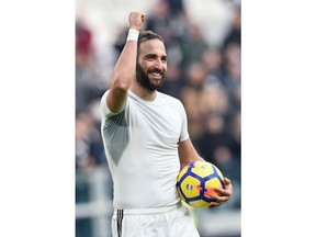 Juventus' Gonzalo Higuain celebrates at the end of the Italian Serie A soccer match between Juventus and Sassuolo at the Allianz Stadium in Turin, Italy, Sunday, Feb. 4, 2018. Higuain scored an hat trick in Juventus 7 - 0 victory.
