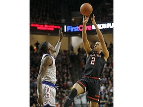 Texas Tech's Zhaire Smith (2) shoots over Kansas' Lagerald Vick (2) during the first half of an NCAA college basketball game Saturday, Feb. 24, 2018, in Lubbock, Texas.