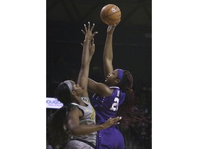 TCU center Jordan Moore, right, shoots over Baylor center Kalani Brown during the first half of an NCAA college basketball game Saturday, Feb. 10, 2018, in Waco, Texas.