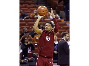 Oklahoma guard Trae Young warms up before an NCAA college basketball game against Texas, Saturday, Feb. 3, 2018, in Austin, Texas.