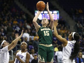 Baylor forward Lauren Cox (15) shoots over TCU defenders Amber Ramirez, left, Sydney Coleman (21), and Toree Thompson (1) during the first half of an NCAA college basketball game, Saturday, Feb. 24, 2018 in Fort Worth, Texas.