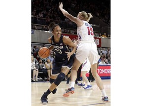 Connecticut guard/forward Katie Lou Samuelson (33) works against SMU forward Stephanie Collins (15) during the first half of an NCAA college basketball game Saturday, Feb. 24, 2018, in Dallas.