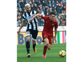 Udinese's Valon Behrami, left, and Roma's Cenzig Under, vie for the ball during the Italian Serie A soccer match between Udinese and Roma at the Friuli stadium in Udine, Italy, Saturday, Feb. 17, 2018.