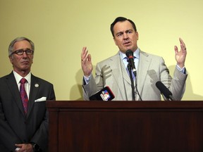 Utah House Speaker Greg Hughes, right, speaks as Republican Rep. Gage Froerer, left, looks on during a news conference Tuesday, Feb. 20, 2018, in Salt Lake City. Hughes is backing an effort to repeal the death penalty in the state three years after lawmakers voted to reinstate the use of the firing squad as a backup execution method. Hughes and Froerer say it will be an uphill battle to persuade the GOP-controlled Legislature to ban capital punishment even though a similar ban came close to passing two years ago.