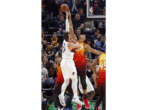 Utah Jazz center Rudy Gobert (27) blocks the shot of Portland Trail Blazers center Jusuf Nurkic (27) during the first half during an NBA basketball game Friday, Feb. 23, 2018, in Salt Lake City.