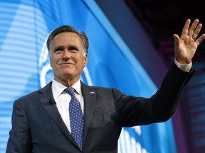 FILE - In this Jan. 19, 2018,, file photo, former Republican presidential candidate Mitt Romney waves after speaking about the tech sector during an industry conference, in Salt Lake City. Romney plans to announce Utah Senate campaign Thursday, Feb. 15, 2018. Three people with direct knowledge of the plan say Romney will formally launch his campaign in a video.