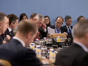 U.S. Secretary for Defense Jim Mattis, center rear, attends a meeting of the North Atlantic Council at NATO headquarters in Brussels on Thursday, Feb. 15, 2018.