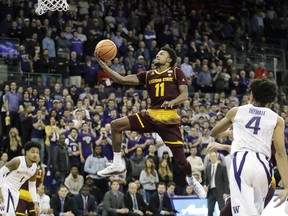 Arizona State guard Shannon Evans II (11) puts up a shot against Washington guard Matisse Thybulle (4) in the first half of an NCAA college basketball game, Thursday, Feb. 1, 2018, in Seattle.