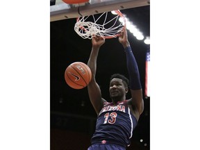 Arizona forward Deandre Ayton dunks during the first half of the team's NCAA college basketball game against Washington State in Pullman, Wash., Wednesday, Jan. 31, 2018.