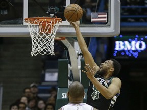 Milwaukee Bucks' Jabari Parker, in his season debut, shoots a layup during the first half of the team's NBA basketball game against the New York Knicks on Friday, Feb. 2, 2018, in Milwaukee.