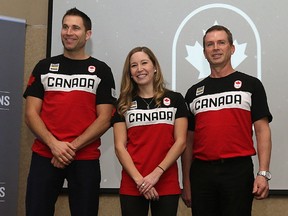 The Canadian Olympic Committee and Curling Canada presented its mixed doubles team —John Morris, left, Kaitlyn Lawes and coach Jeff Stoughton — in Winnipeg on Jan. 8, 2018.