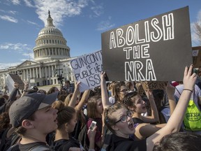 In this Feb. 21, 2018, photo, school students from Montgomery County, Md., in suburban Washington, rally in solidarity with those affected by the shooting at Parkland High School in Florida, at the Capitol in Washington. Member of Congress return from a 10-day recess under enormous pressure to respond to gun violence after the Parkland high school shooting. Despite a long list of legislative proposals, including many flowing from President Donald Trump, few ideas seem poised for passage.