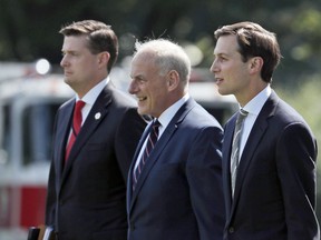 FILE - In this Aug. 4, 2017 file photo, from left, White House Staff Secretary Rob Porter, White House Chief of Staff John Kelly, and White House senior adviser Jared Kushner walk to Marine One on the South Lawn of the White House in Washington. President Donald Trump was en route to Bedminster, N.J., for vacation.  White House staff secretary Porter has resigned following allegations of domestic abuse by his two ex-wives.