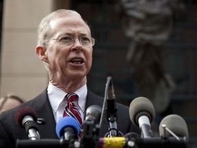FILE - In this Jan. 26, 2012 file photo, Dana Boente, then First Assistant U.S. Attorney for the Eastern District of Virginia, speaks outside federal court in Alexandria, Va.  Boenete, an understated career federal prosecutor, has found himself at the epicenter of several of the Trump administration's biggest controversies.