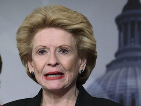 In this Feb. 7, 2018 photo, Sen. Debbie Stabenow, D-Mich., speaks during a news conference to announce a bipartisan resolution that would establish a special committee in the Senate to investigate the U.S. Olympic Committee and USA Gymnastics regarding how team doctor Larry Nassar was allowed to sexually abuse female gymnasts over decade.
