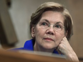 FILE- In this Dec. 5, 2017, file photo, Sen. Elizabeth Warren, D-Mass., waits to speak during a meeting of the Senate Banking Committee on Capitol Hill in Washington. Warren said Wednesday that President Donald Trump is disrespecting Native Americans by referring to her as "Pocahontas," and she says that while she's not enrolled in any tribe, "I never used my family tree to get a break or ... advance my career."