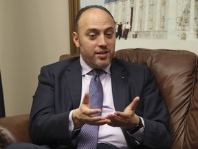 Husam Zomlot, the Palestinian envoy to Washington, speaks during an interview with the Associated Press in Washington, Friday, Feb. 16, 2018. A few miles down the road from Israel's gated embassy, Zomlot sits in his office wrestling with a unique diplomatic dilemma: how to advance his people's cause at a time relations with the United States are so distant, he hasn't even spoken to the White House in months.