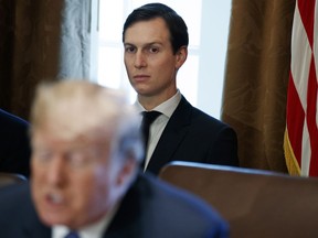 FILE - In this Nov. 1, 2017, file photo, White House senior adviser Jared Kushner listens as President Donald Trump speaks during a cabinet meeting at the White House in Washington. Politico is reporting that the security clearance of White House senior adviser and Trump son-in-law Jared Kushner has been downgraded.