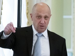 FILE - In this Tuesday, Aug. 9, 2016 file photo, businessman Yevgeny Prigozhin gestures at the Konstantin palace outside St. Petersburg, Russia. One of those indicted in the Russia probe is a businessman with ties to Russian President Vladimir Putin. Prigozhin is an entrepreneur from St. Petersburg who's been dubbed "Putin's chef" by Russian media. His restaurants and catering businesses have hosted the Kremlin leader's dinners with foreign dignitaries.
