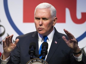In this Feb. 1, 2018, photo, Vice President Mike Pence addresses the Republican National Committee (RNC) Winter Meeting in Washington. Credit Pence with good timing when it comes to trying to avoid political messes. Another government shutdown looms at week's end and the Russia investigation is grabbing headlines, but the vice president will be at the Olympics in South Korea.
