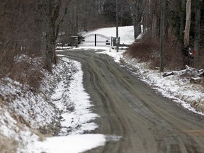 In this Feb. 1, 2018, photo, the gates of Leather Hill Preserve are located down a sparsely populated dirt road in Wingdale, N.Y. A company tied to Donald Trump Jr. and Eric Trump owns the 171-acre hunting preserve that is being used as a private shooting range, where the sound of rifle fire from a wooden tower and exploding targets has riled nearby residents, neighbors told The Associated Press.