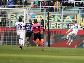 Bologna's Rodrigo Palacio, right, scores his side's opening goal during the Serie A soccer match between Inter Milan and Bologna at the San Siro stadium in Milan, Italy, Sunday, Feb. 11, 2018.