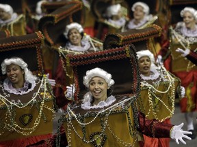 Dancers from the Imperio de Casa Verde samba school perform during a carnival parade in Sao Paulo, Brazil, Sunday, Feb. 11, 2018.