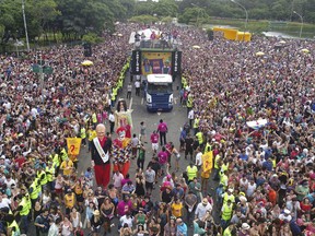 In this Saturday, Feb. 3, 2018 photo, people fill the street during the Bicho Maluco Beleza carnival "bloco" parade in Sao Paulo, Brazil. Carnival has been flourishing in this megacity that for decades used to be a ghost town during this time of year. Many cite political unrest as a reason street parties were initially wiped out in Sao Paulo, a center of the anti-government union movement during the 1964-1985 dictatorship.
