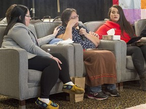 Barbara Bernard is flanked by her daughter Deana Beaton, left, and granddaughter Kindra Bernard at the National Inquiry into Missing and Murdered Indigenous Women and Girls in Moncton, N.B. on Wednesday, Feb. 14, 2018. Bernard told the inquiry about the life and death of her mother, Mary Francis Paul.